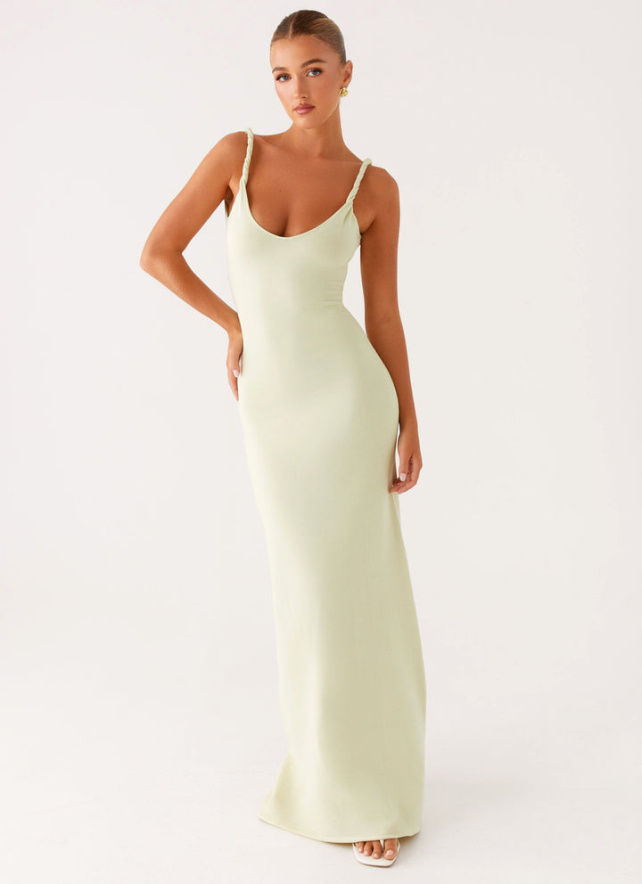 Woman wearing soft blue maxi dress