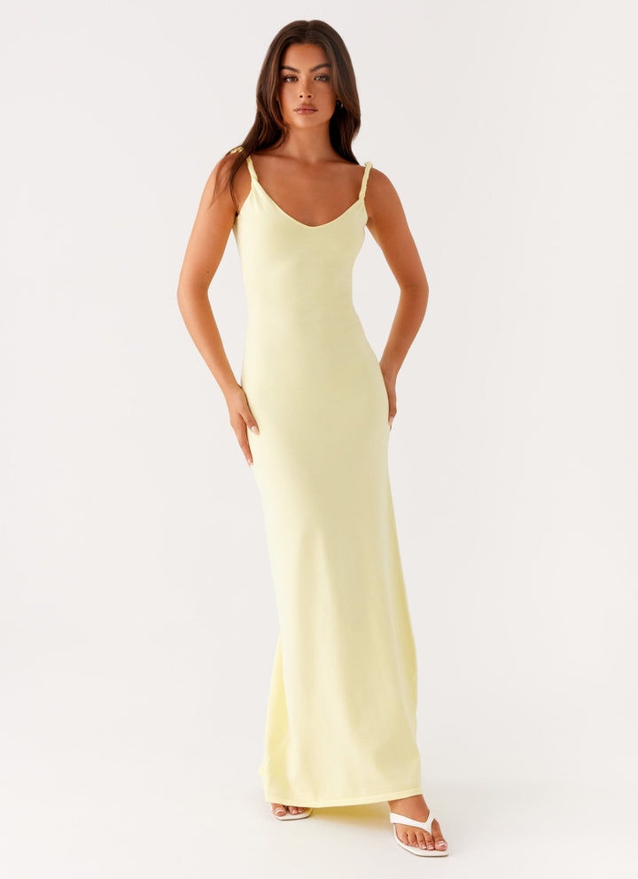Woman wearing soft blue maxi dress