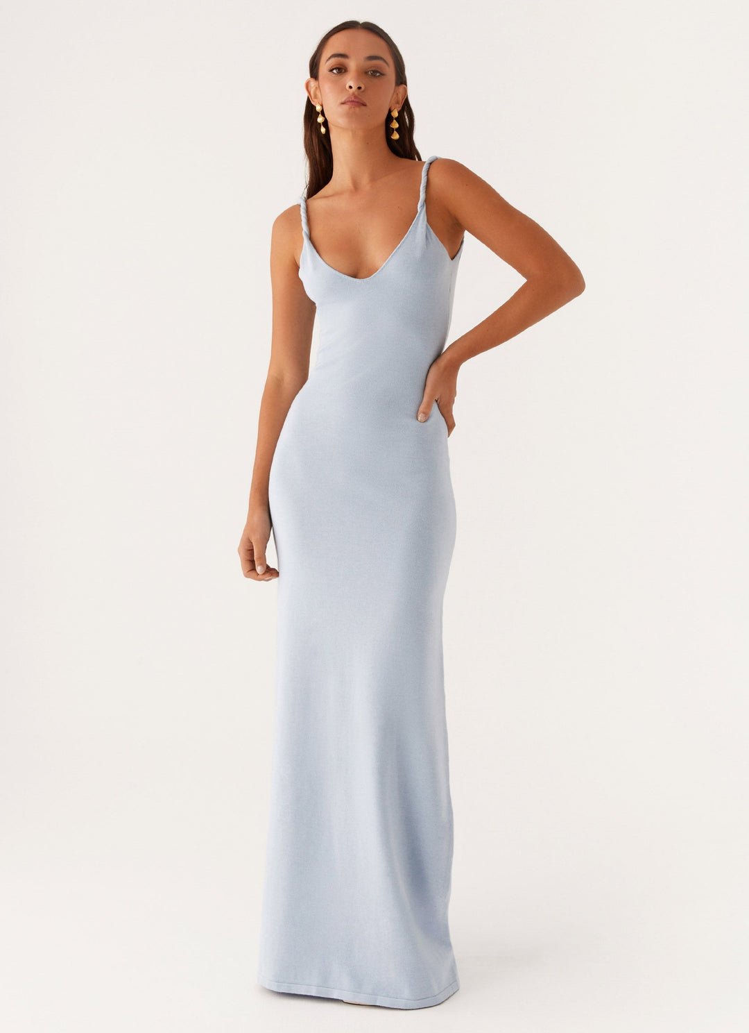 Woman wearing soft blue maxi dress