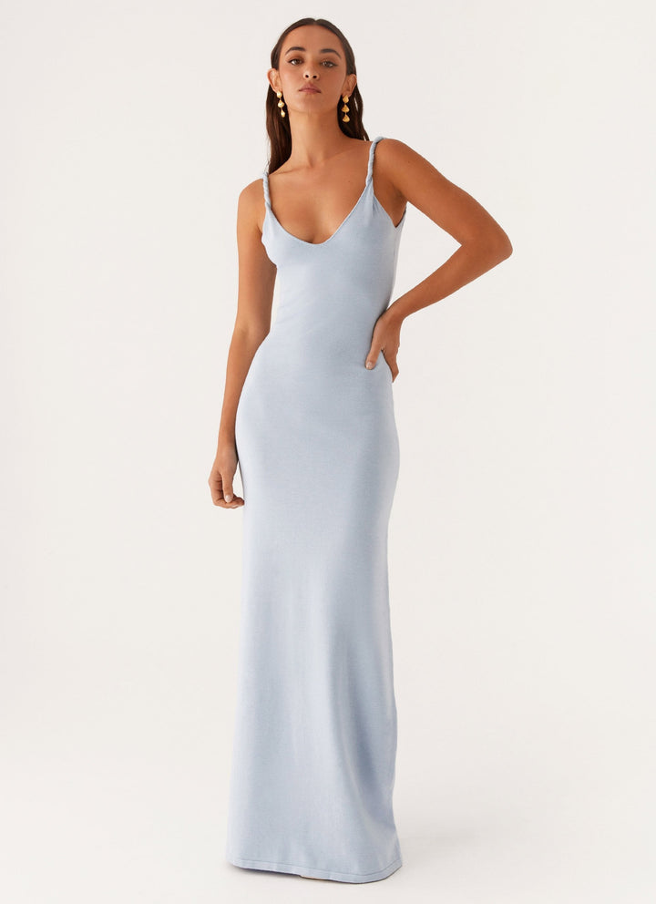 Woman wearing soft blue maxi dress