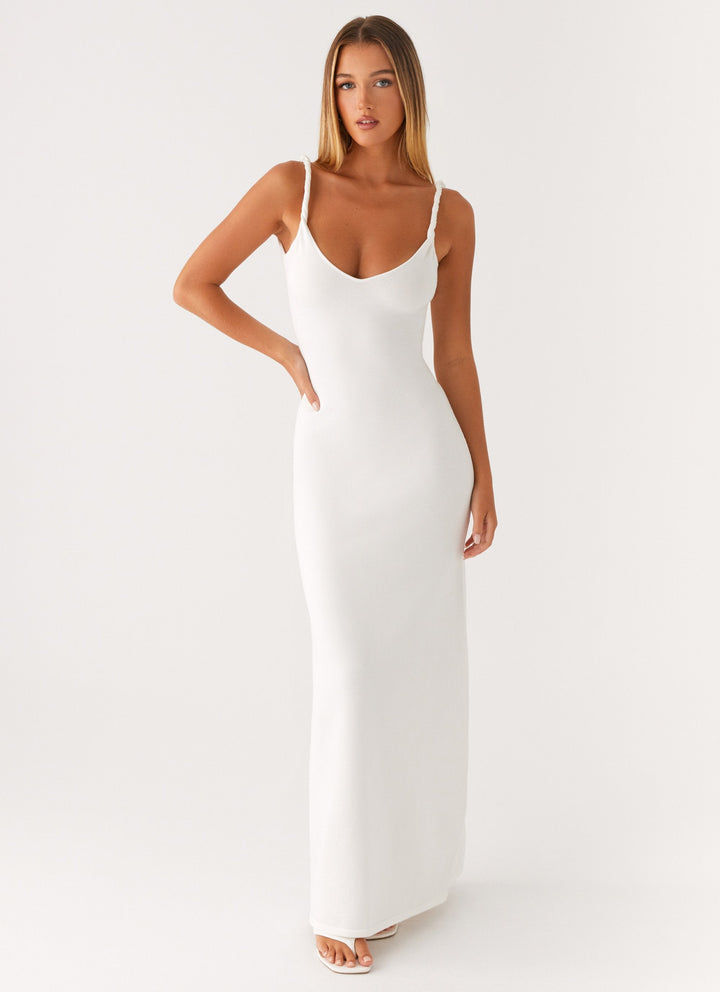 Woman wearing soft blue maxi dress