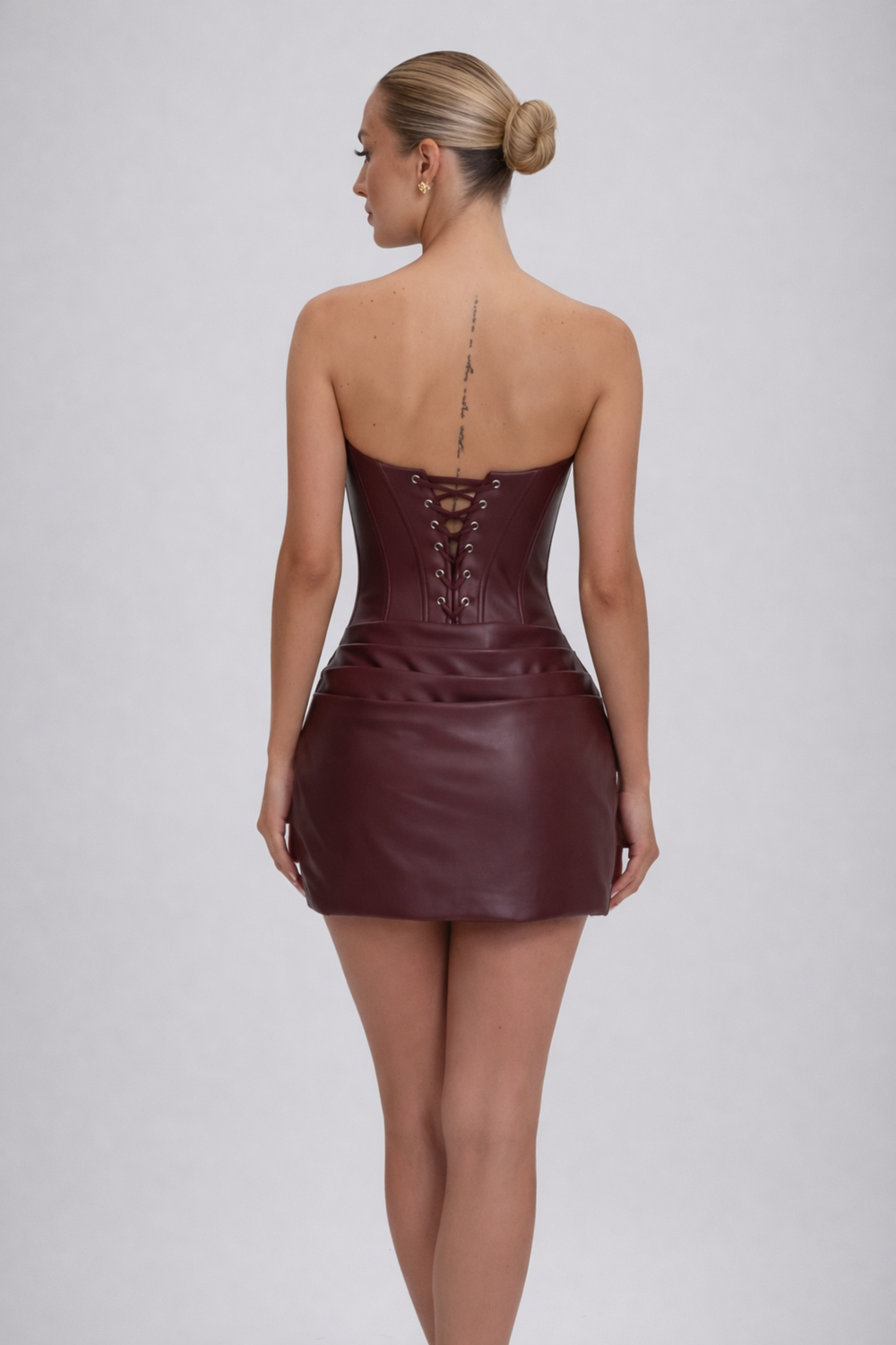 Woman wearing luxe corset mini dress
