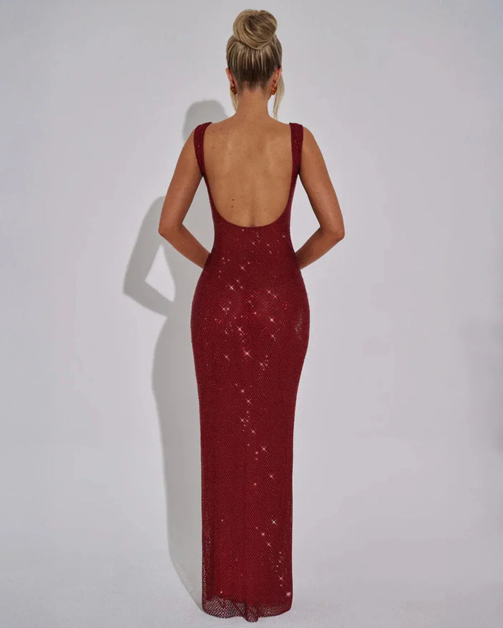 Woman wearing red sequin maxi dress