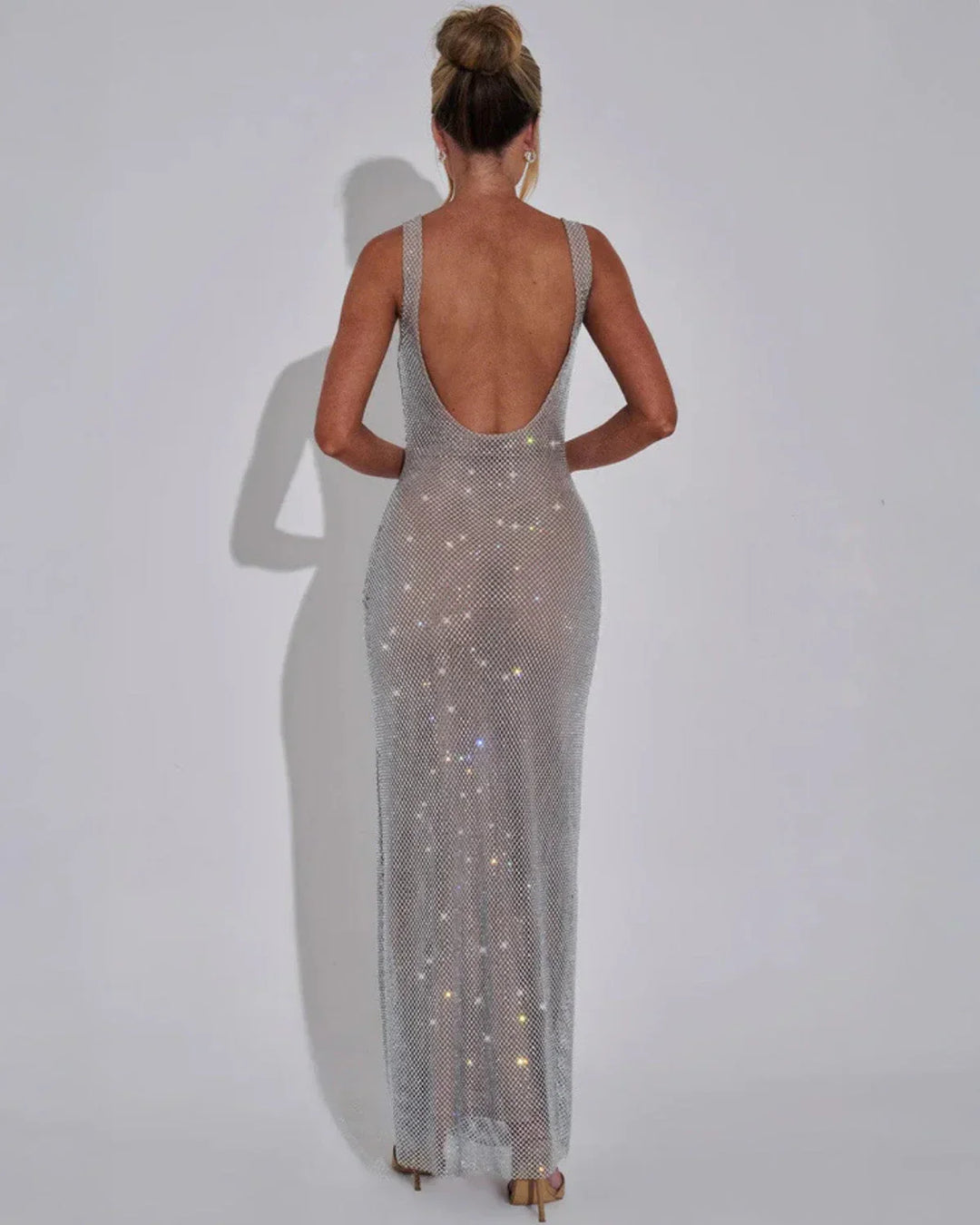 Woman wearing red sequin maxi dress