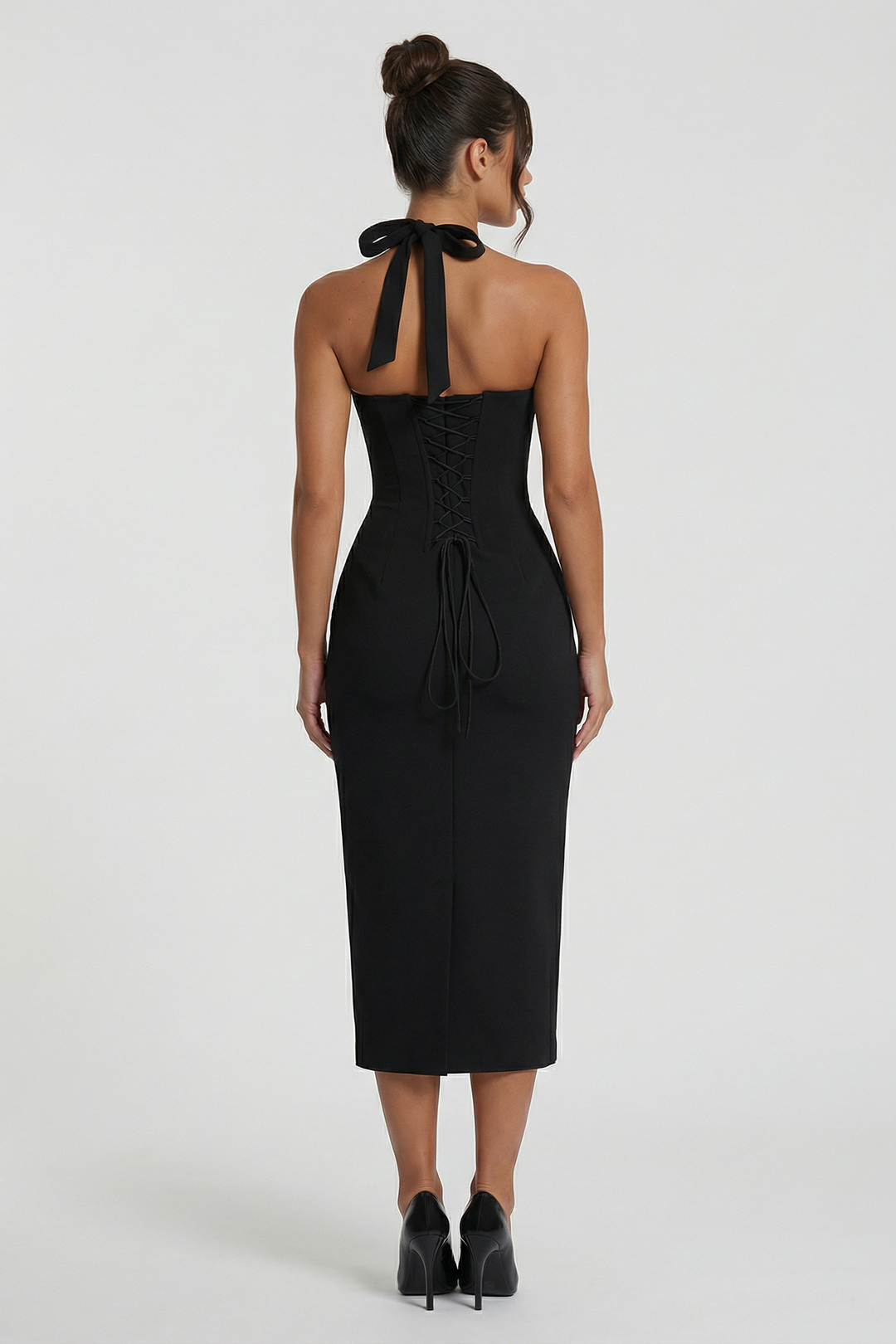 Woman wearing elegant halter midi dress
