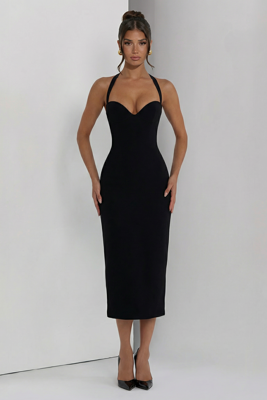 Woman wearing elegant halter midi dress