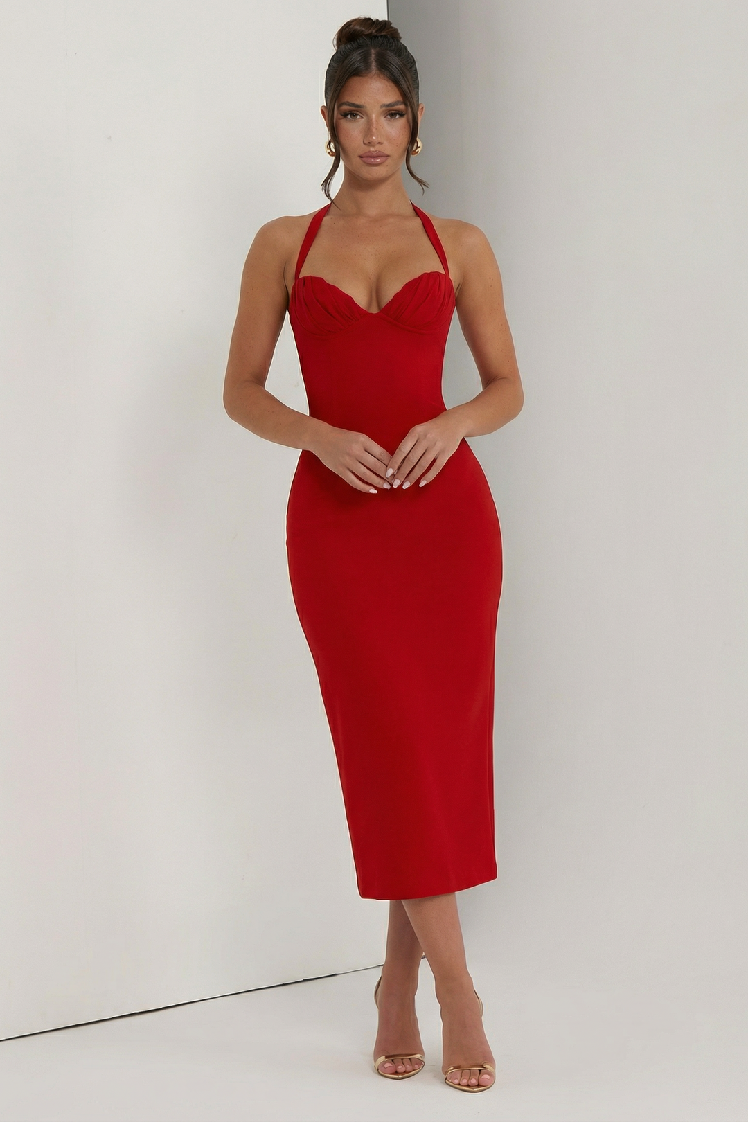 Woman wearing elegant halter midi dress