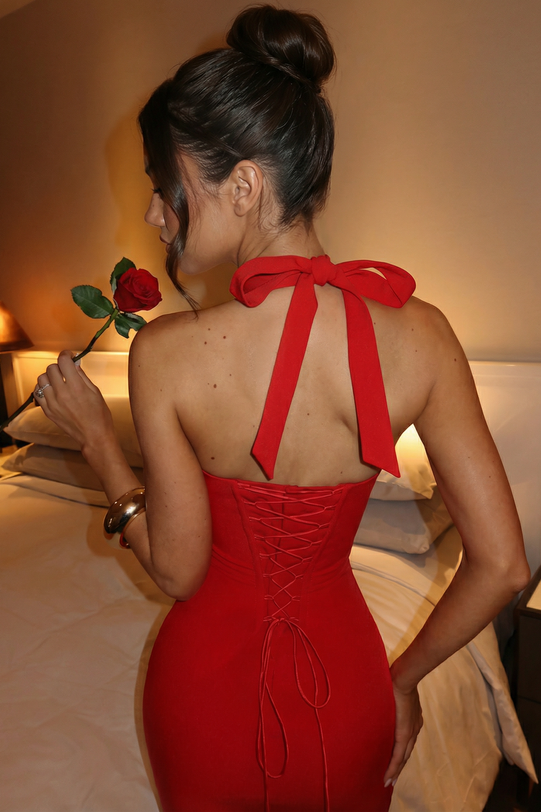 Woman wearing elegant halter midi dress