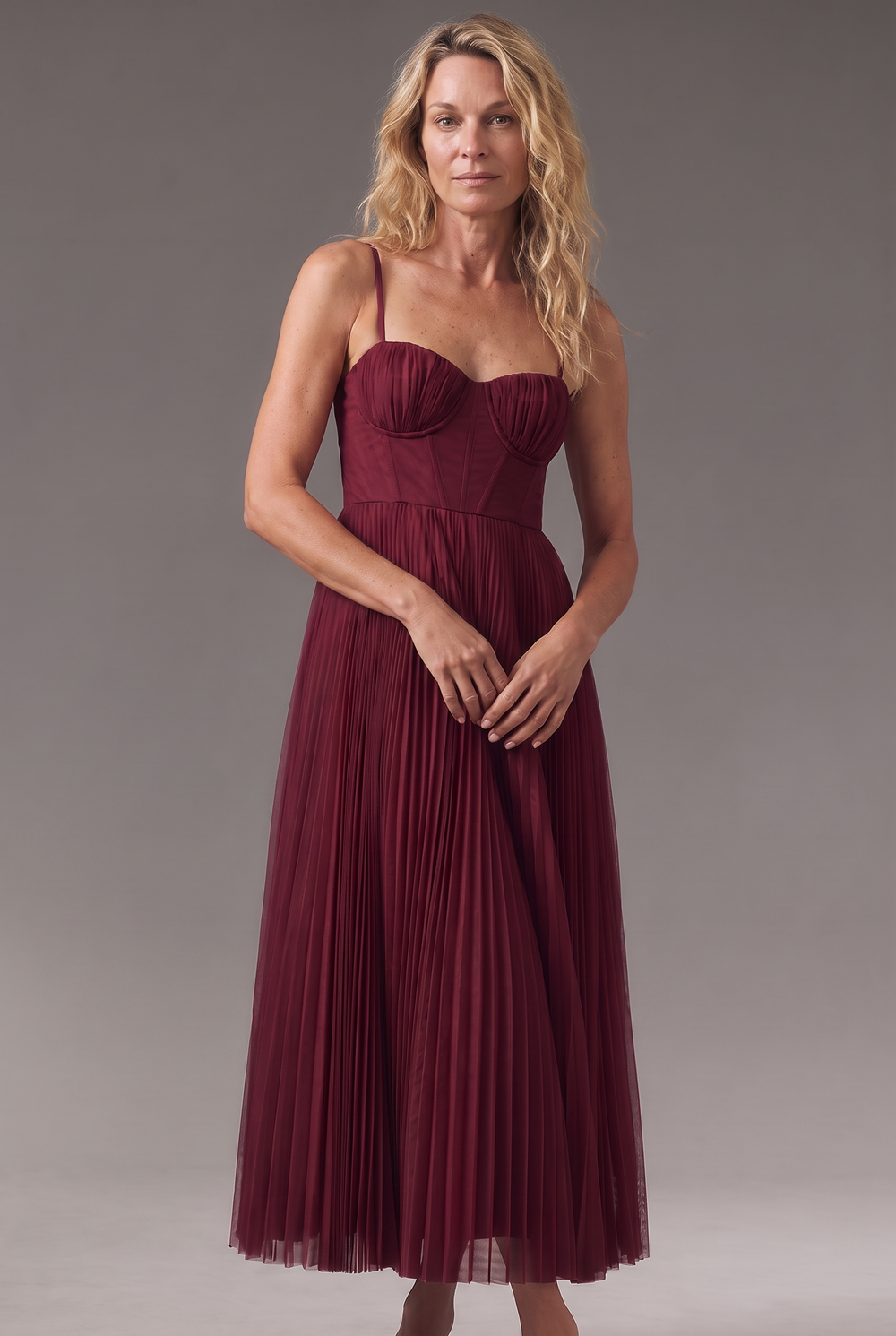 Woman wearing pleated midi dress