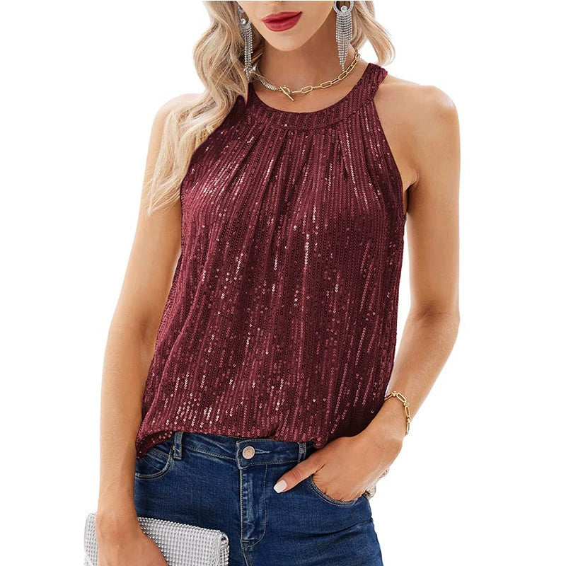 Oriane Delaunay sequin halter neck blouse in burgundy with a pleated neckline, worn with jeans
