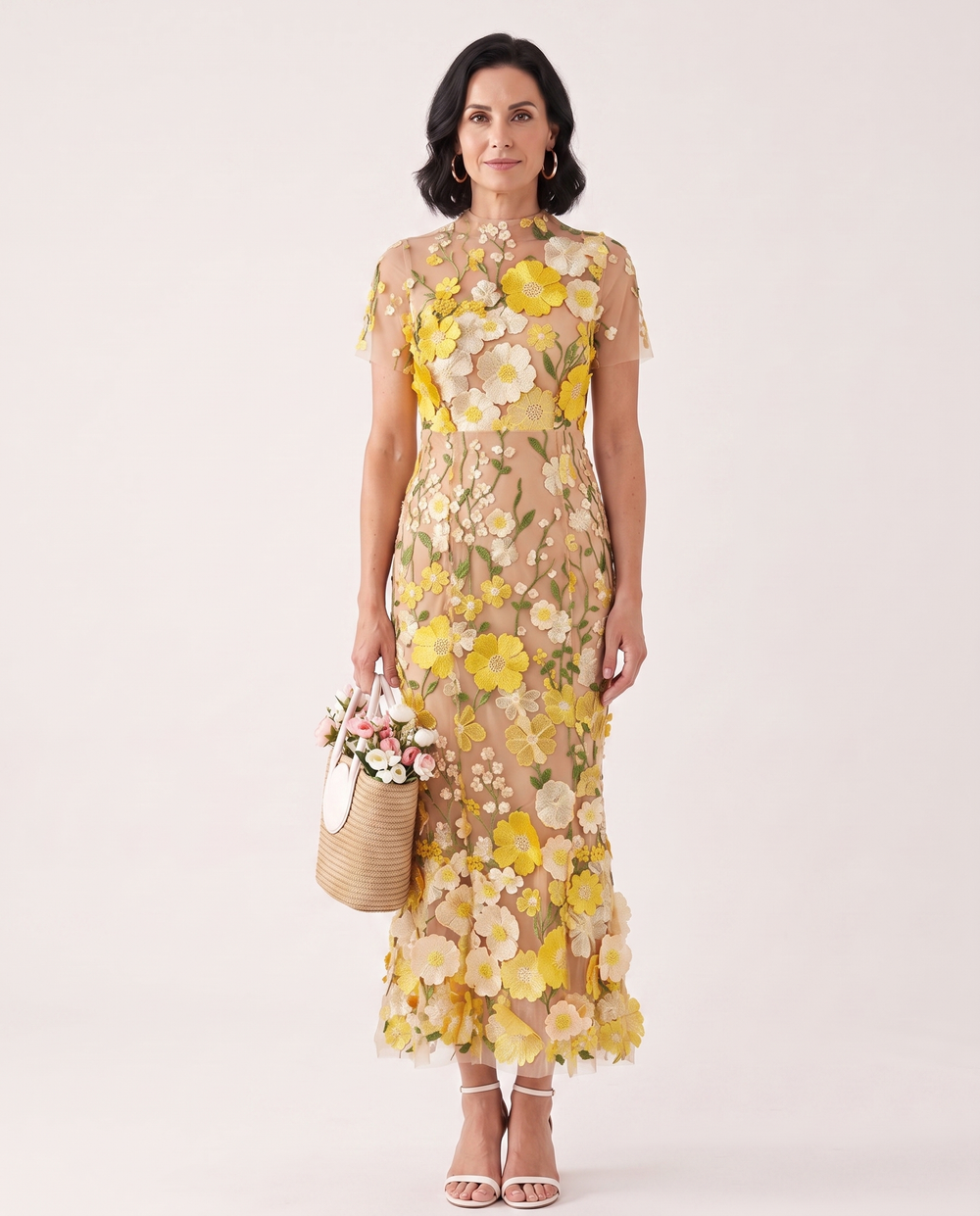 Woman wearing floral embroidered midi dress
