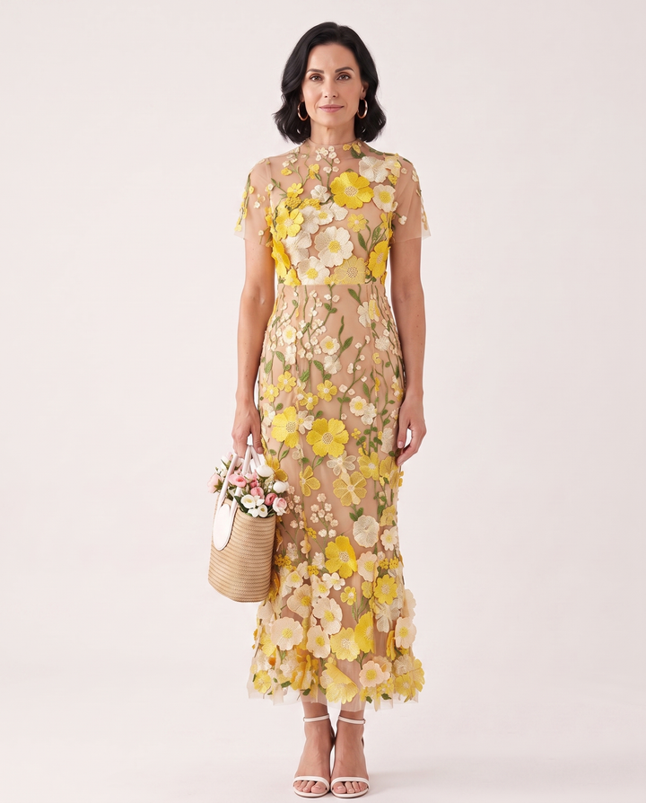Woman wearing floral embroidered midi dress