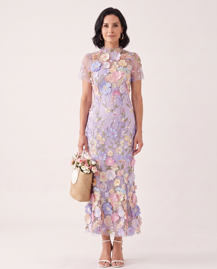 Woman wearing floral embroidered midi dress