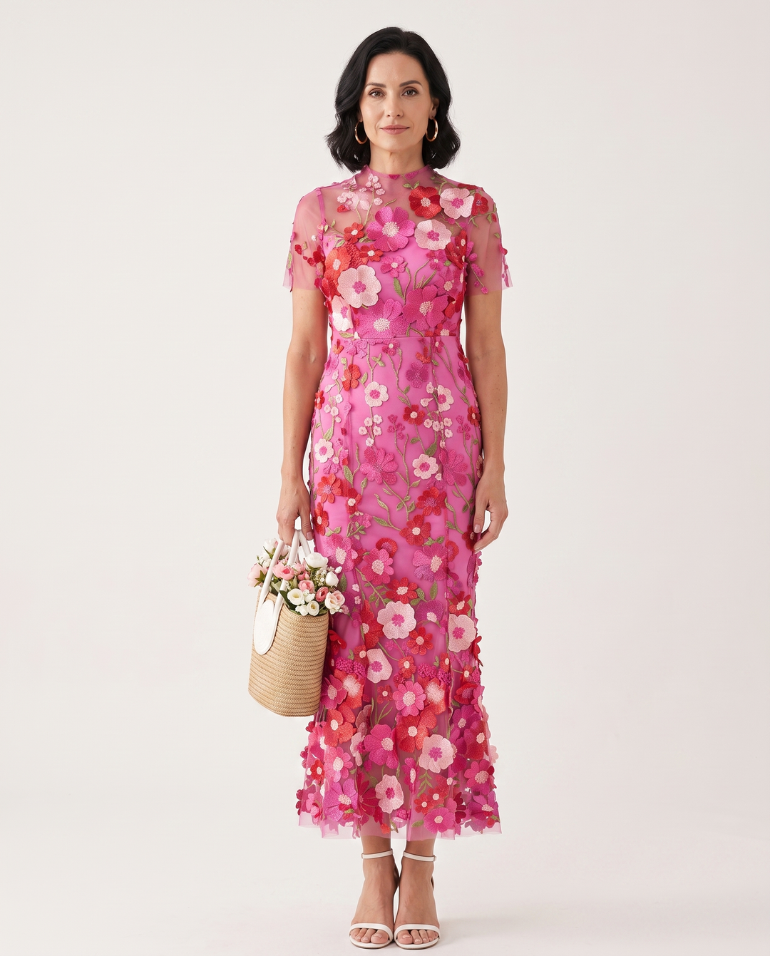 Woman wearing floral embroidered midi dress