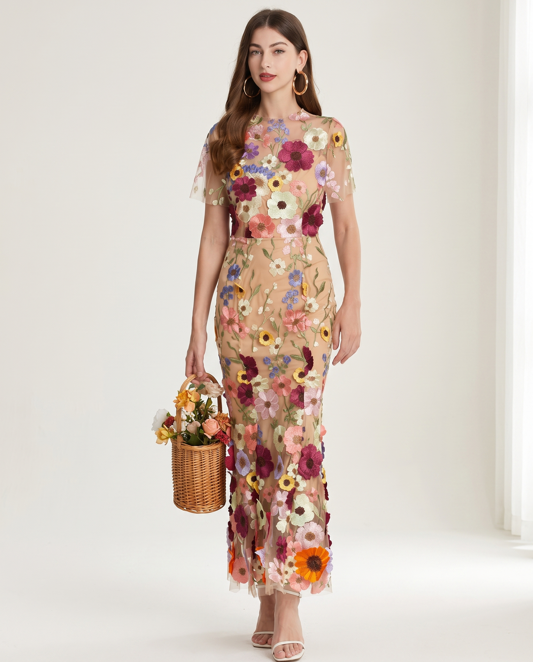 Woman wearing floral embroidered midi dress