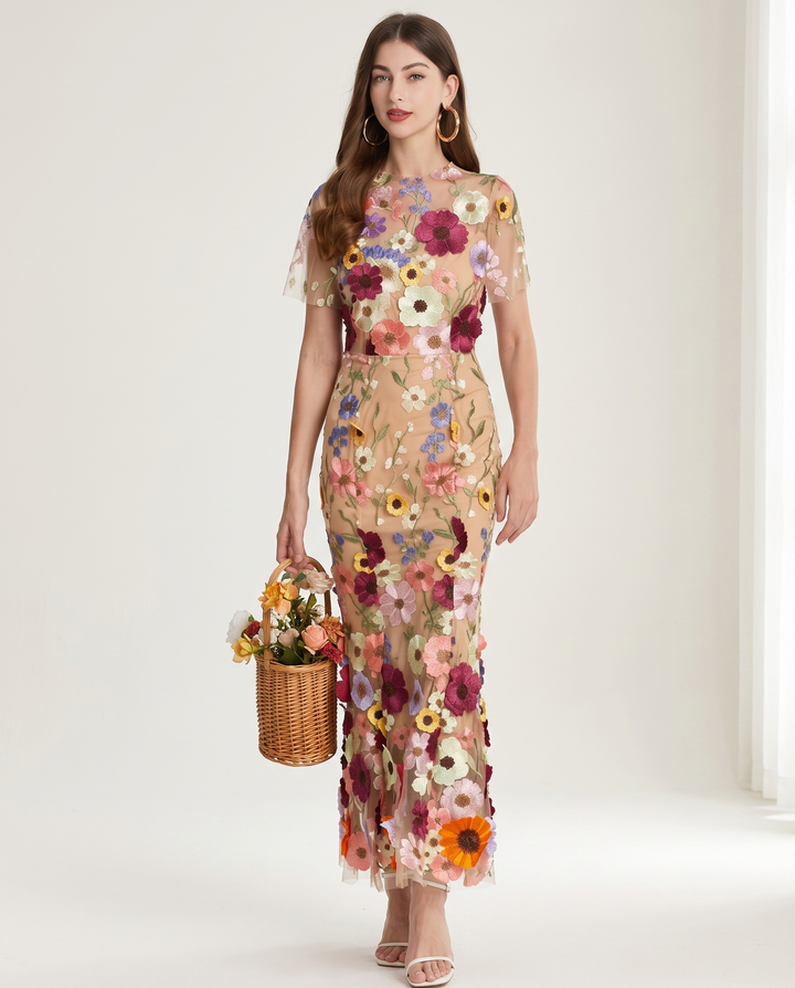 Woman wearing floral embroidered midi dress