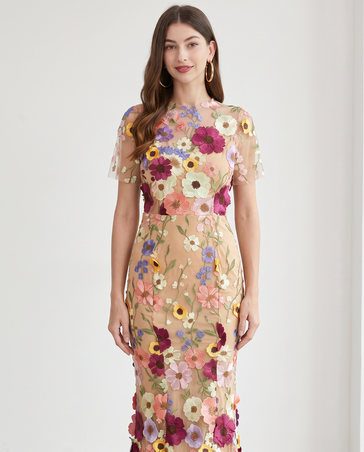 Woman wearing floral embroidered midi dress