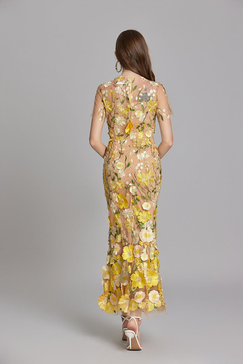 Woman wearing floral embroidered midi dress
