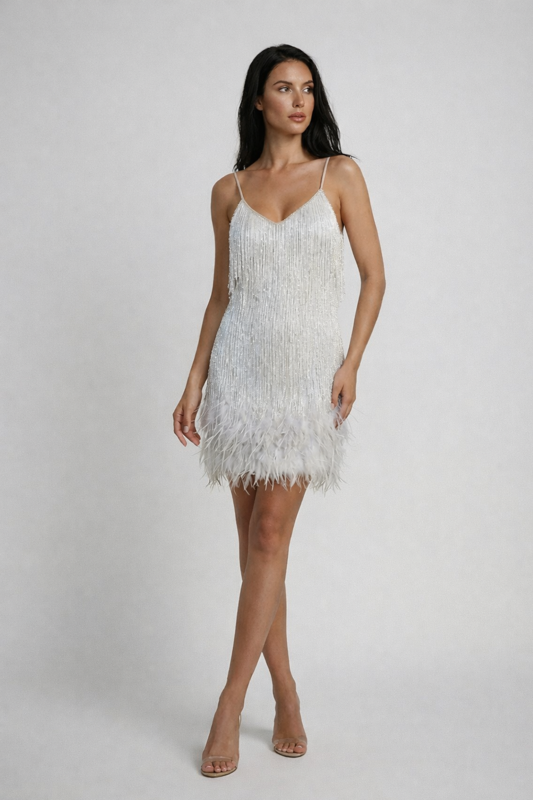Woman wearing sequin feather mini dress