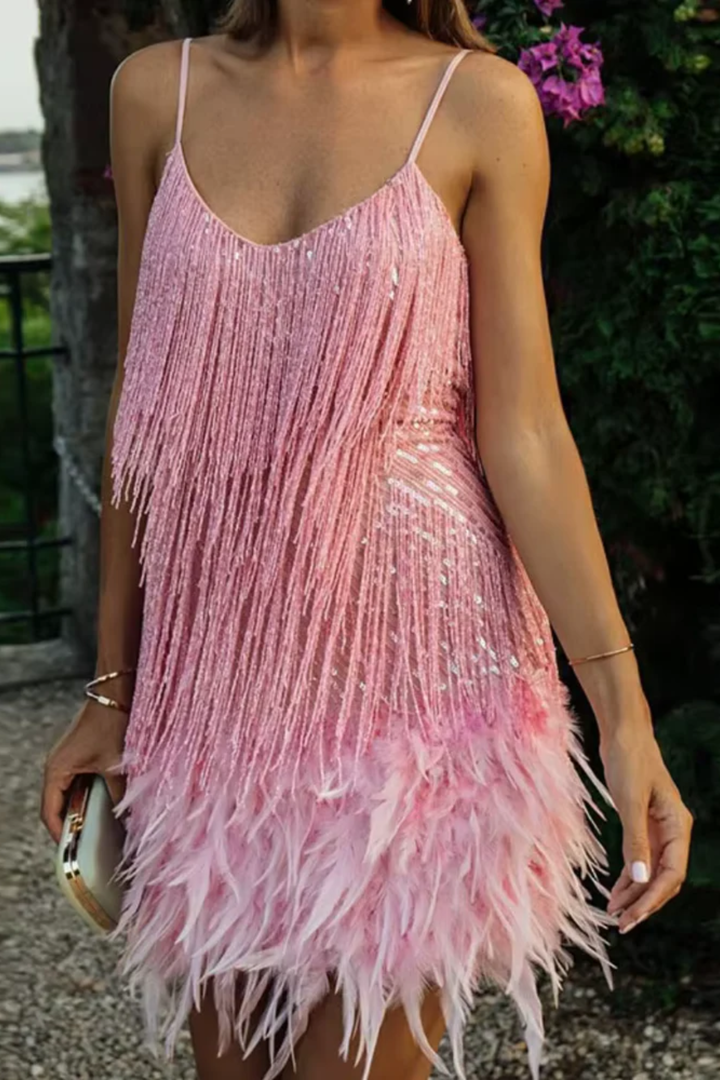 Woman wearing sequin feather mini dress