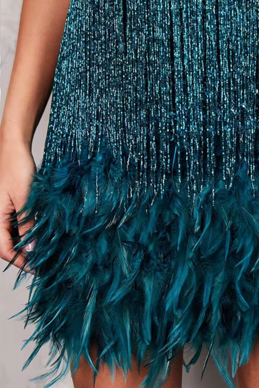 Woman wearing sequin feather mini dress