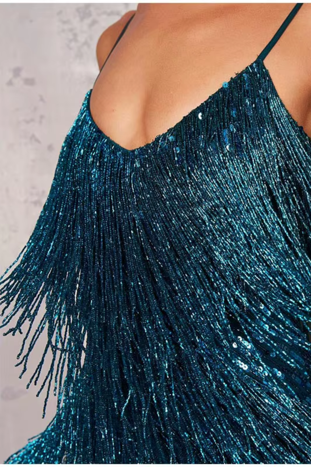 Woman wearing sequin feather mini dress