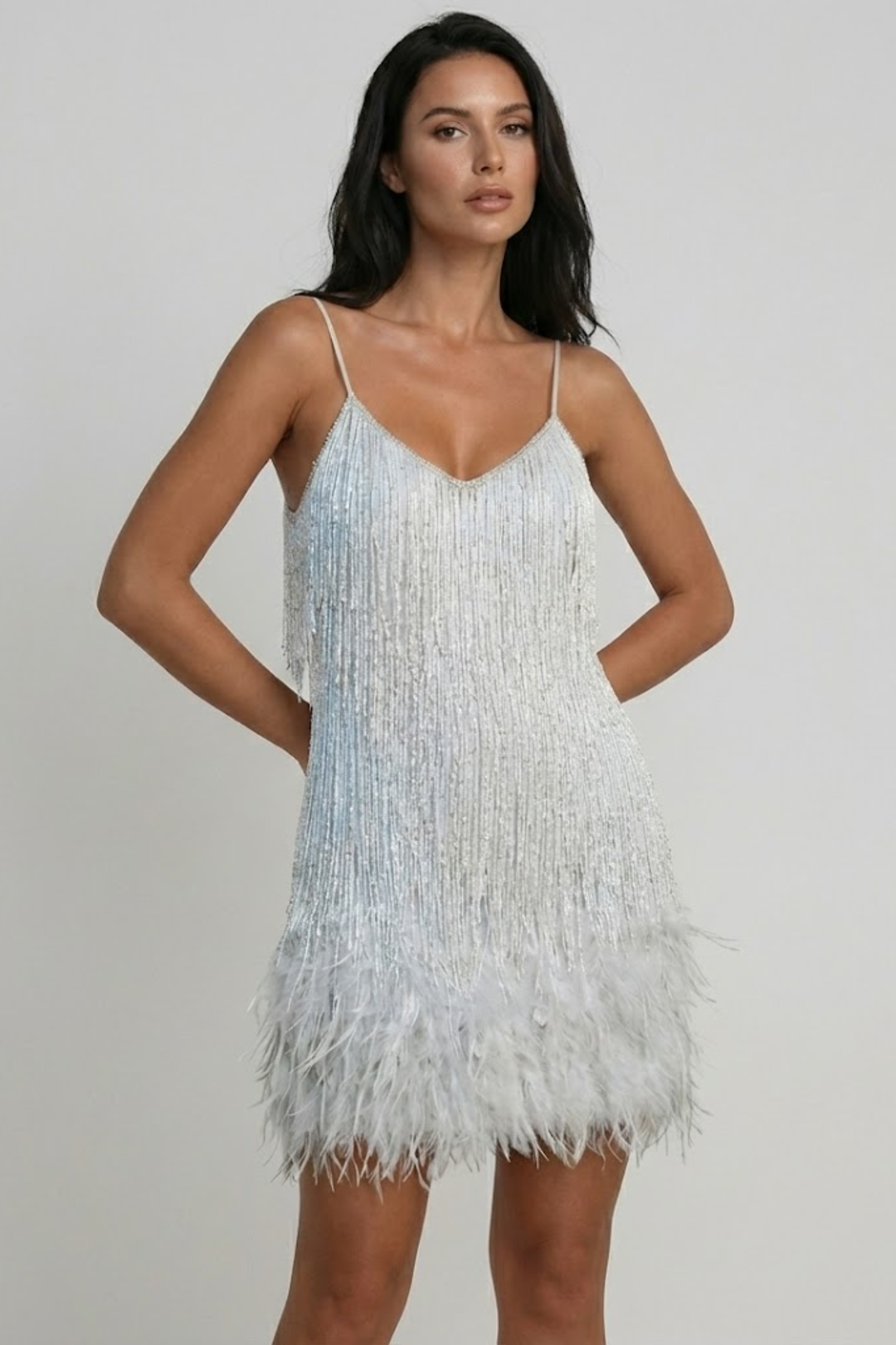 Woman wearing sequin feather mini dress