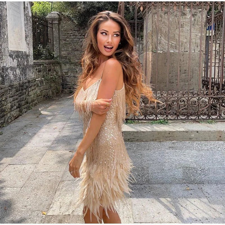 Rosalinde Cassagne fringe mini dress with tiered tassel strands, a feather trimmed hem and deep V neckline