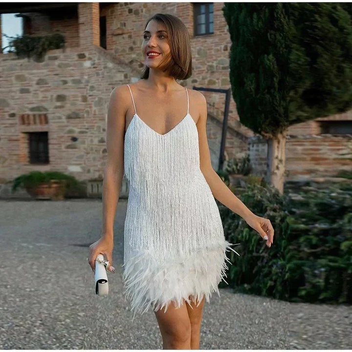 Rosalinde Cassagne fringe mini dress with tiered tassel strands, a feather trimmed hem and deep V neckline