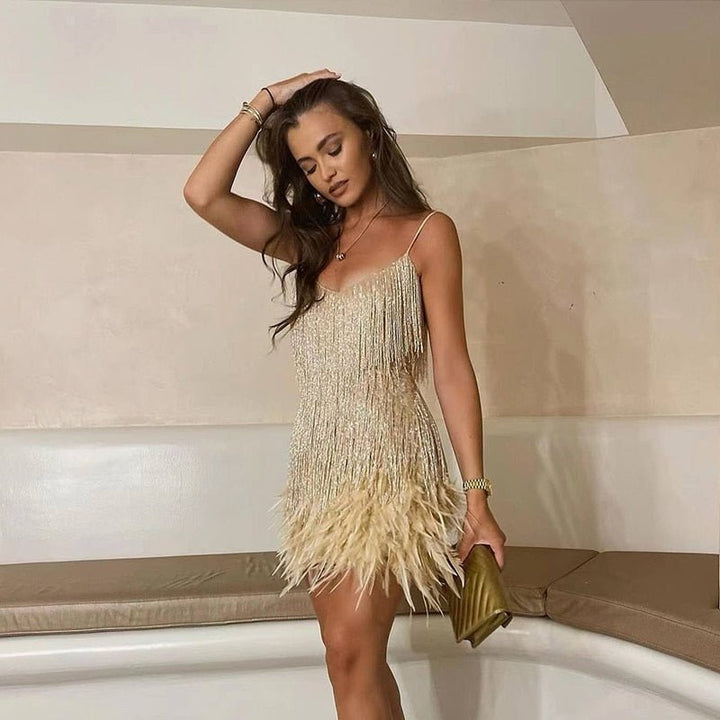 Rosalinde Cassagne fringe mini dress with tiered tassel strands, a feather trimmed hem and deep V neckline