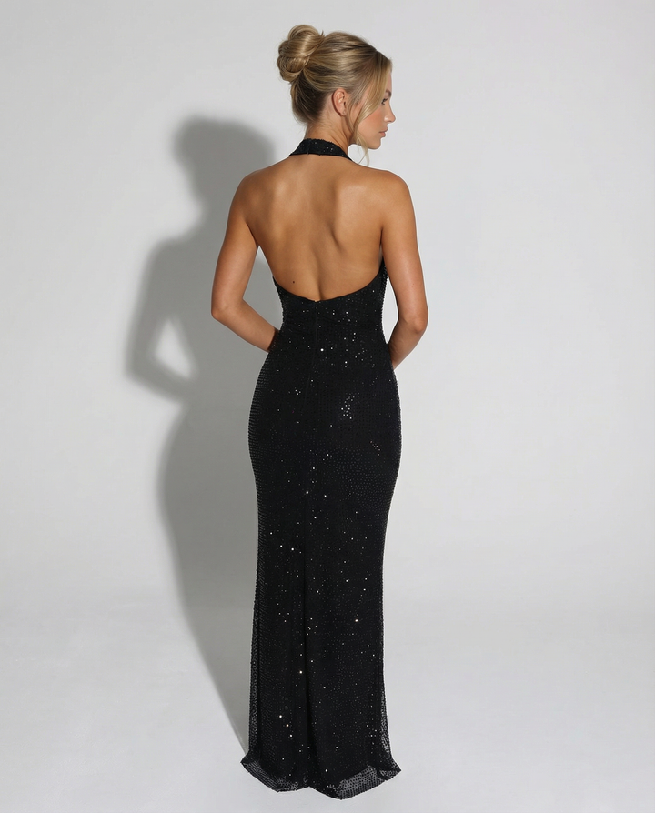 Woman wearing sequin halter maxi dress