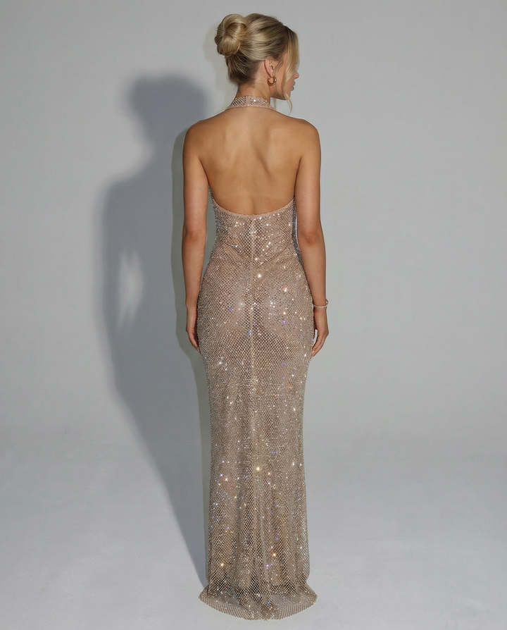 Woman wearing sequin halter maxi dress