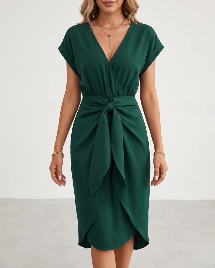 Woman wearing midi wrap dress with tie waist