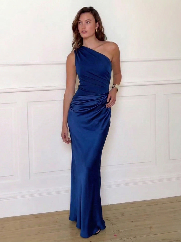 Woman wearing one-shoulder satin evening dress