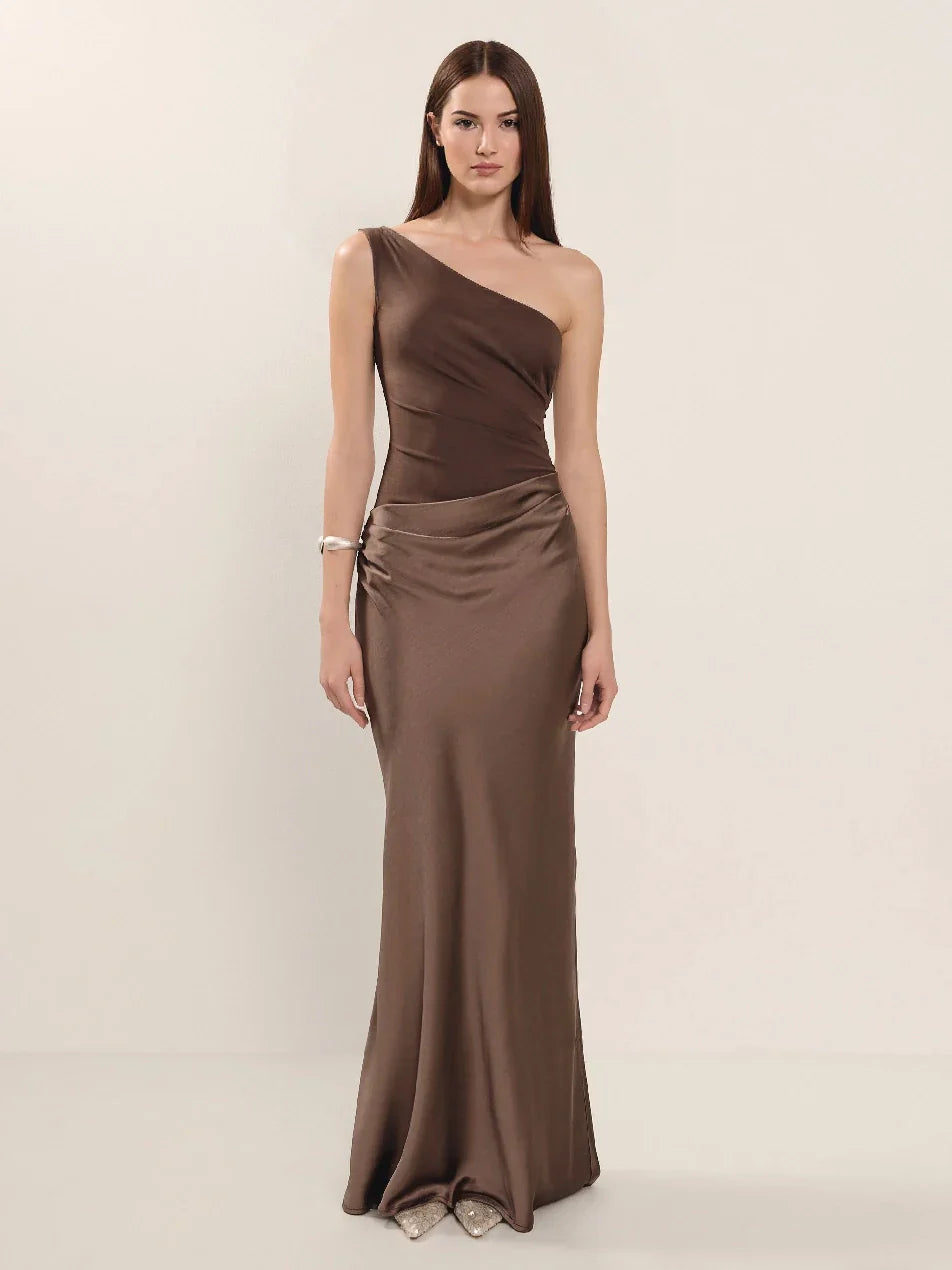 Woman wearing one-shoulder satin evening dress