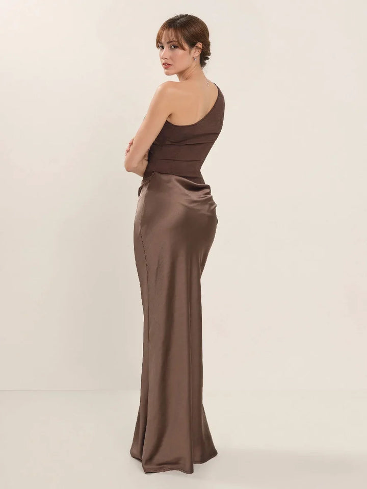 Woman wearing one-shoulder satin evening dress