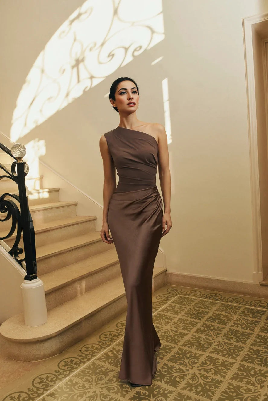 Woman wearing one-shoulder satin evening dress