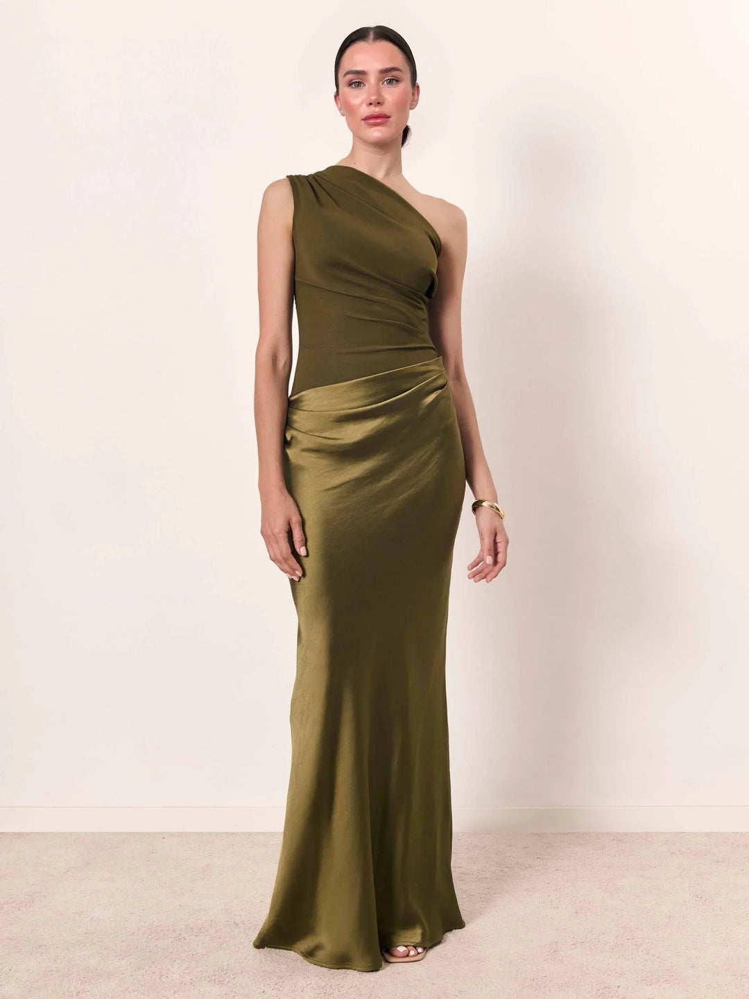 Woman wearing one-shoulder satin evening dress