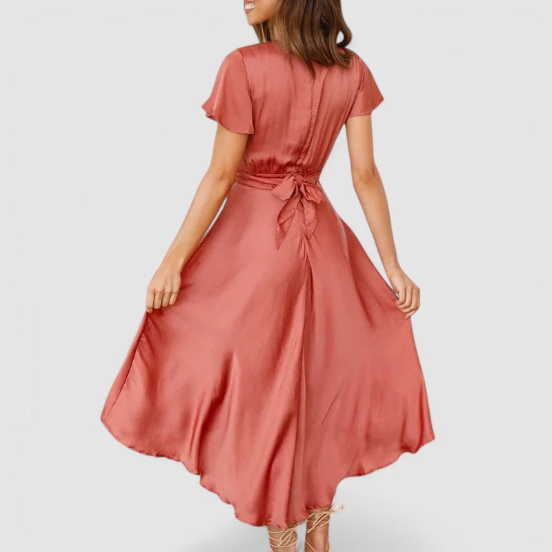 Woman wearing flowing wrap midi dress