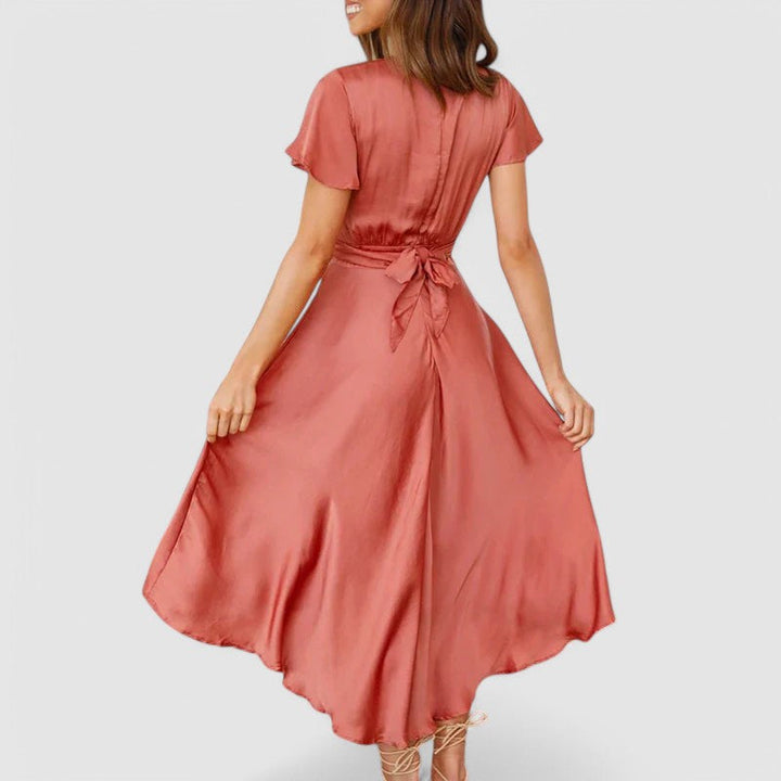 Woman wearing flowing wrap midi dress