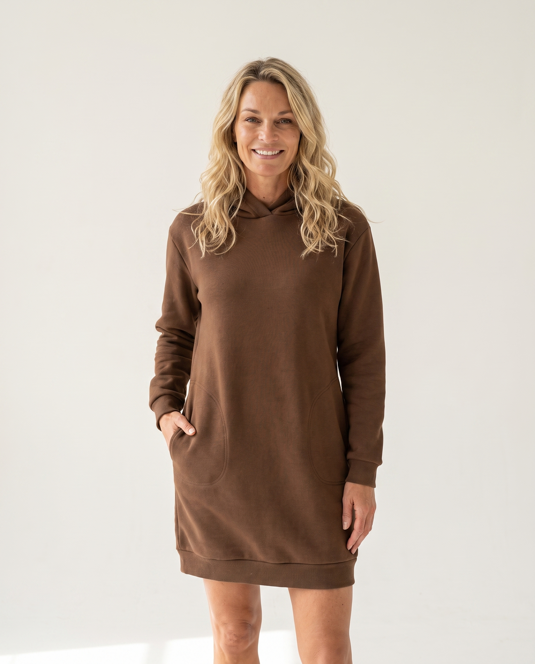 Woman wearing cozy hoodie dress